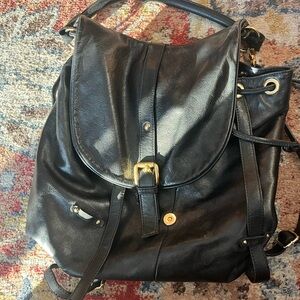 Elegant Black Leather Backpack with Gold Accents